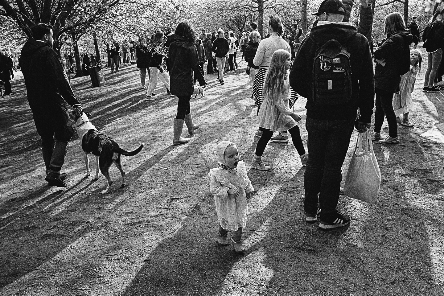 Black and white anlaog photograph of a woman eating a chocolate bar